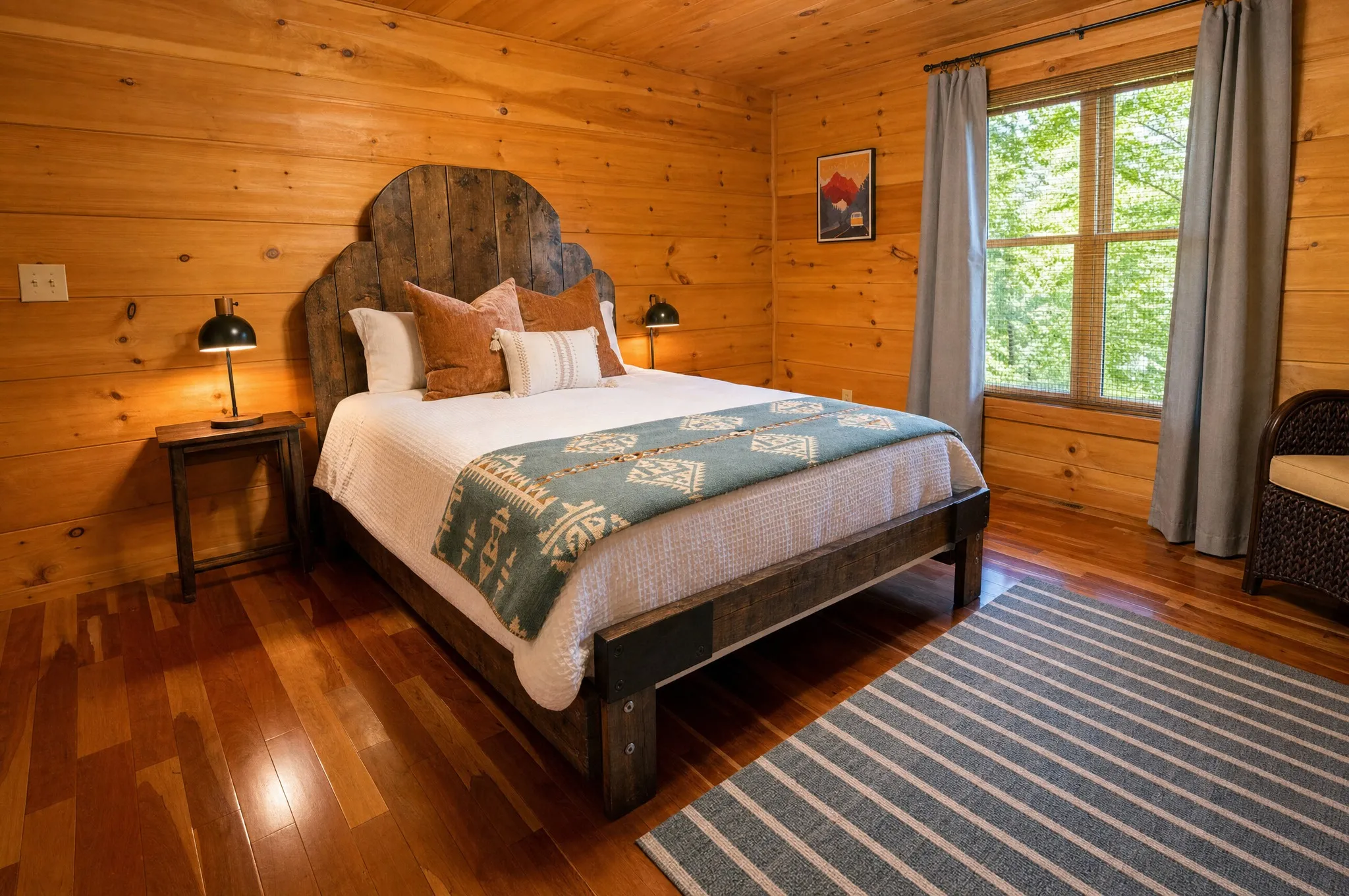 Lower-level queen bedroom with mountain-inspired decor