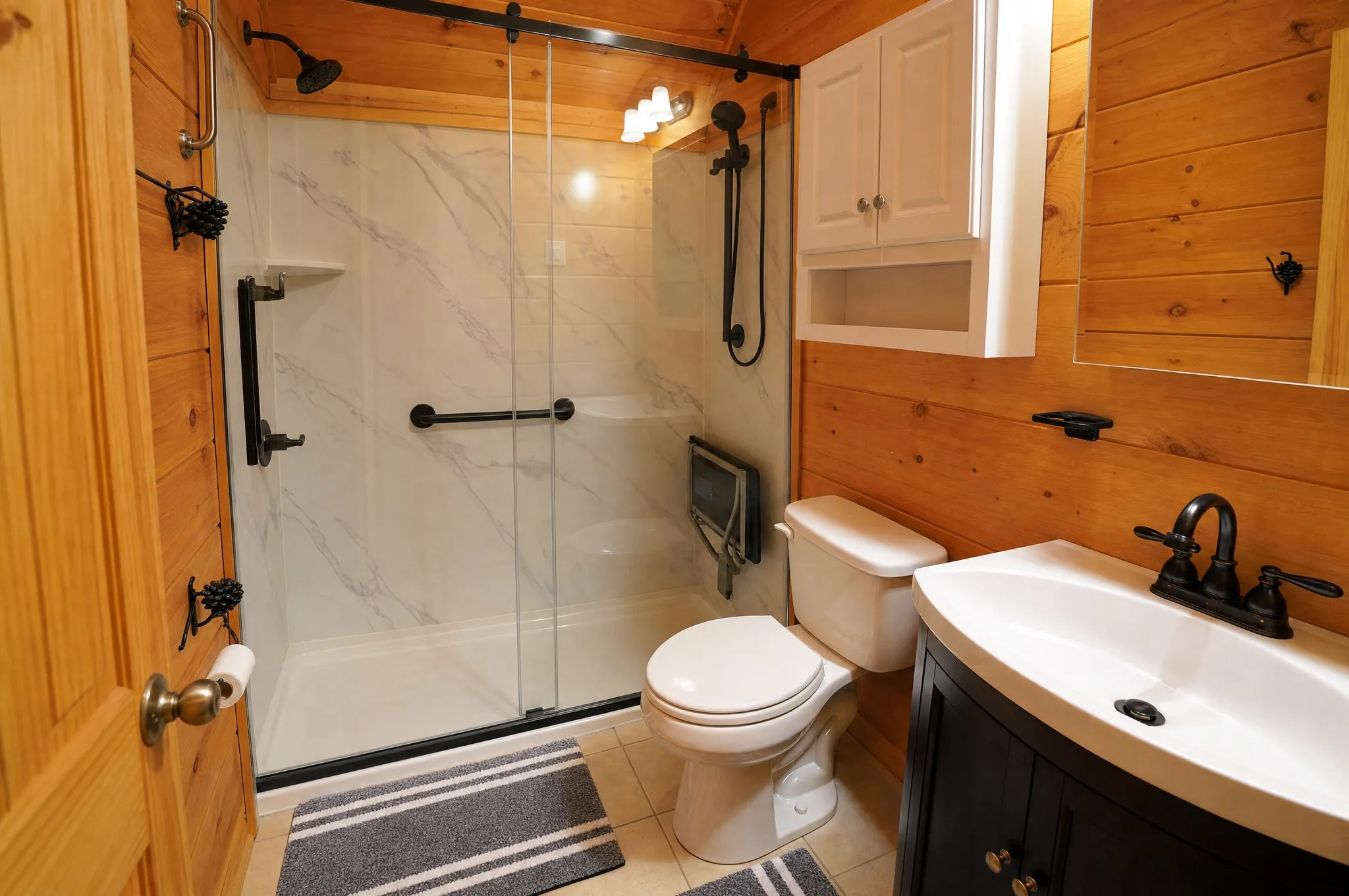 Remodeled bathroom with a walk-in glass shower