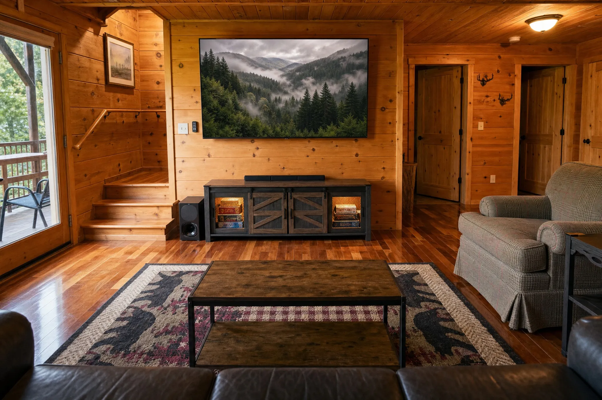 Rec room with a large television and lounge seating